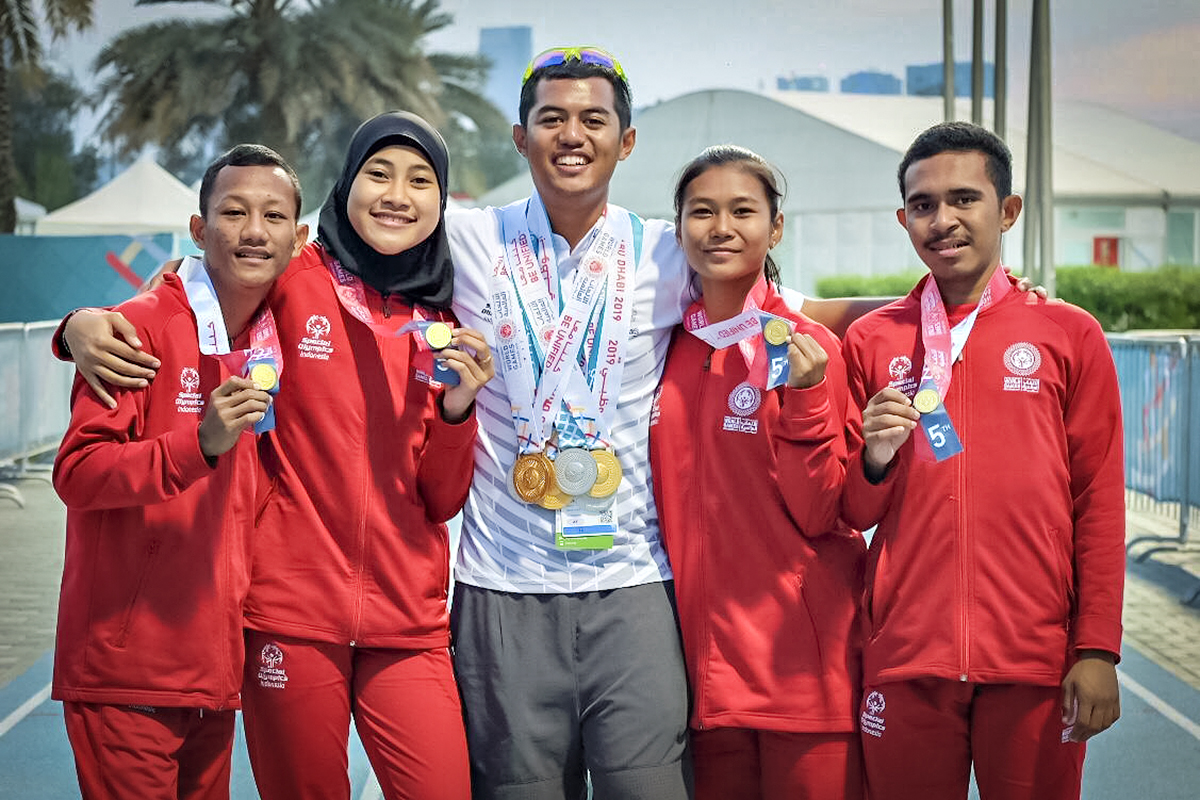 Williems Doroh, a Special Olympics Asia Pacific athlete, with his Indonesian teammates at the World Games in Abu Dhabi.