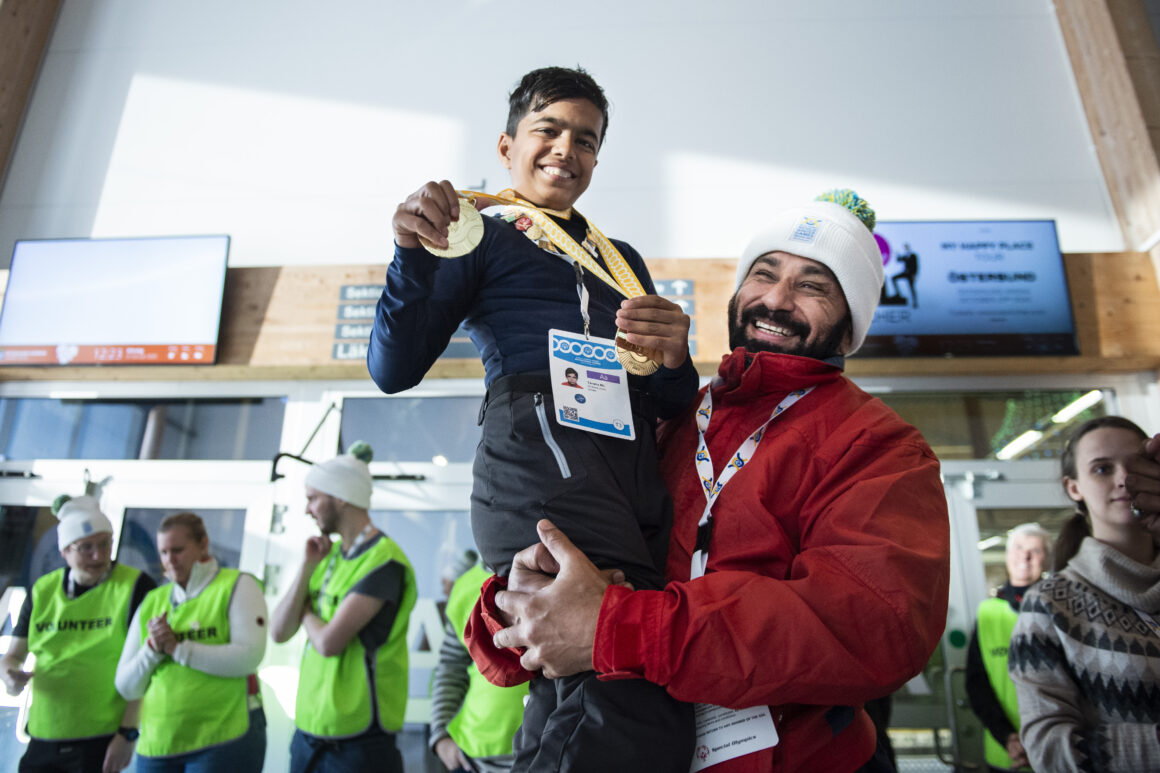 TANSHU (LEFT) HOLDING HIS MEDALS WITH HIS COACH, MR CHANDRAHAS SHARMA (RIGHT).