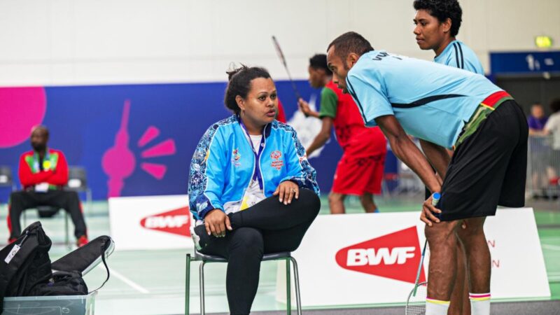 Coach Tagici in conversation with her student.