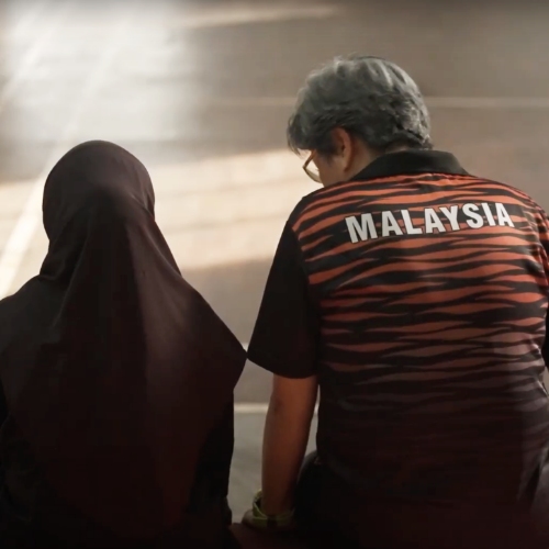 Syakila (left) with Coach Kristil (right).